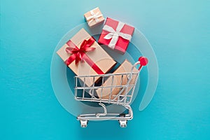 Gift boxes in cart symbolize online shopping convenience photo