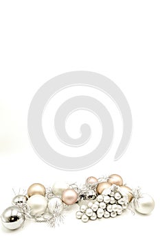 Gift boxes and Christmas decorations with silvered ribbons in white background