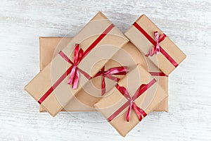 Gift boxes and Christmas wreath with a luminous garland. Blurred background without focus with bokeh