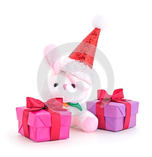 Gift boxes, gifts and toy hare on a white background isolated