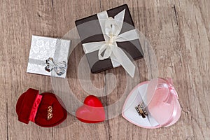 gift boxes with gold jewelry on the table.