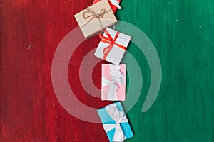 gift boxes on a green red wooden background