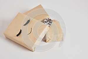 gift boxes with kraft paper on gray background