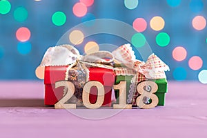 Gift boxes and numbers 2018 on the background bokeh