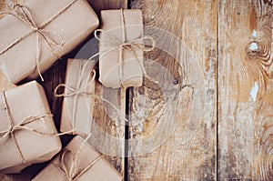Gift boxes, postal parcels on wooden board