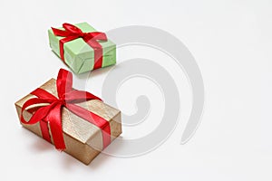Gift boxes with red ribbons on white background