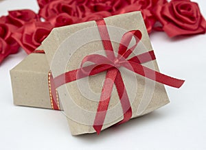 Gift boxes with red satin ribbons