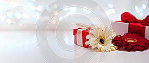 Gift boxes with ribbons and flowers on a white delicate background with bokeh