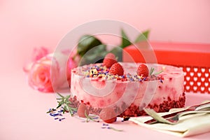 Gift boxes, roses, raspberry cake with fresh berries, rosemary and dry flowers on pink background. Banner, copy space. Valentine '