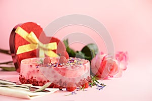 Gift boxes in shape of heart, roses, raspberry cake with fresh berries, rosemary and dry flowers on pink background. Banner, copy