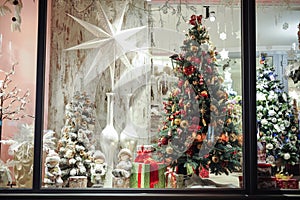 Gift boxes , sweets and christmas decor in shop window