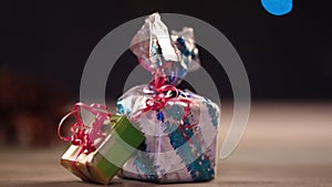 Gift boxes on table with lights in background