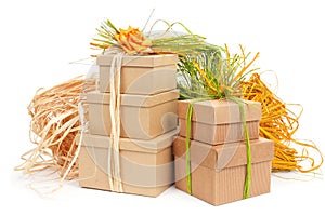 Gift boxes tied with natural raffia of different colors and top