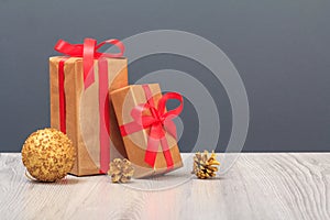 Gift boxes and toy ball on gray background