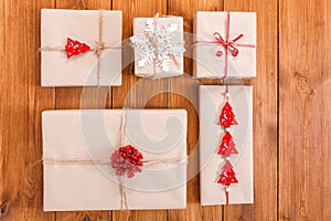 Gift boxes on wood, christmas presents in craft paper