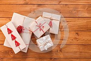 Gift boxes on wood, christmas presents in craft paper