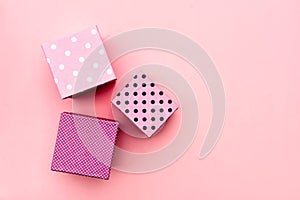 Gift boxs on paste pink background.