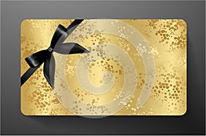 Gift card with black bow ribbon on gold background
