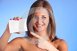 Gift card. Excited woman showing empty blank paper card sign wit