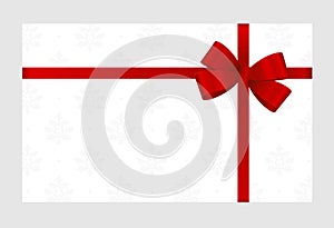 Gift Card With Red Ribbon And A Bow on white background. Gift Voucher Template with place for text.