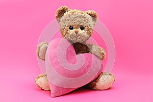 Gift card, teddy bear with pink heart isolated on pink background