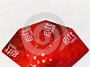 Gift cards. Four red gift cards Arranged in a fan shape.