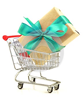 Gift with celadon ribbon in the shopping cart