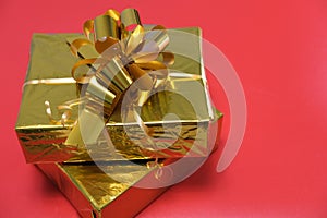 Gift close-up on a red background. Purchase online. Concept for Christmas, New Year 2022, Black Friday.