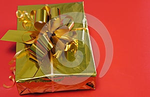 Gift close-up on a red background. Purchase online. Concept for Christmas, New Year 2022, Black Friday.