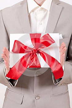 Gift with decorative red ribbon bow