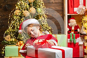 Gift emotions. Christmas kids - happiness concept. Winter kid. New year concept. Happy child with Christmas gift box