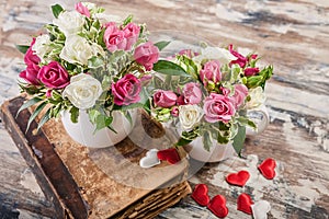 Gift Floristics. Handmade bouquet of roses with herbs in a large mug. Close up. Great gift for Mothers Day, March 8 or Valentines