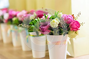Gift flowers in decorative cups