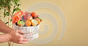 A gift in the form of a basket with flowers and fruits