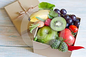 Gift of fresh fruits and vegetables on wooden board healthy diet lifestyle concept