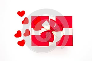 Gift or gift box, red heart on white background top view. Greeting card for Valentine`s Day