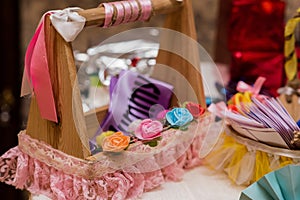 Gift hampers kept in a decorative table in Baby shower ceremony photo