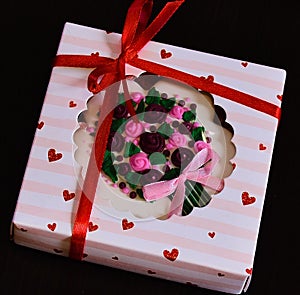 Gift with hearts and red ribbon