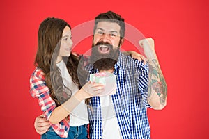 Gift for her dad. Man bearded father and cute little girl daughter on red background. Celebrate fathers day. Family