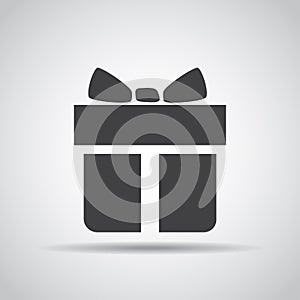 Gift icon with shadow on a gray background. Vector illustration
