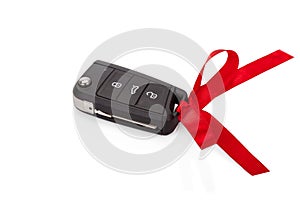 Gift idea: car keys with red ribbon isolated