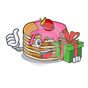 With gift pancake with strawberry mascot cartoon