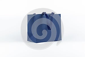 Gift paper bag, shopping bag in classic blue color isolated on white background. Mockup of blank craft package. Concept for