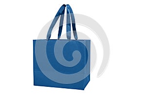 Gift paper bag, shopping bag in classic blue color isolated on white background. Mocr up of blank craft package. Concept for