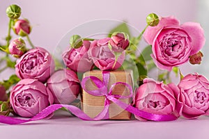 Gift present box with beautiful pink flowers roses bouquet. Concept Mother`s Day, Happy Birthday