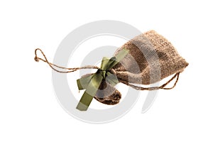 Gift sack with green ribbon isolated on background