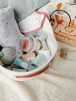 Gift set for a baby shower with toys in soft gender-neutral colors