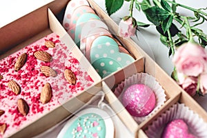 Gift set with hand made sweets in a box on a white table.