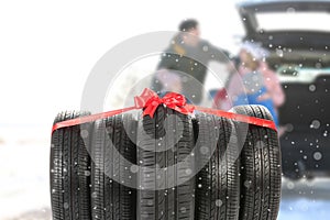 Gift set of winter tires and happy family