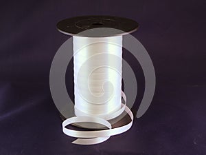 Gift strings on plastic reels